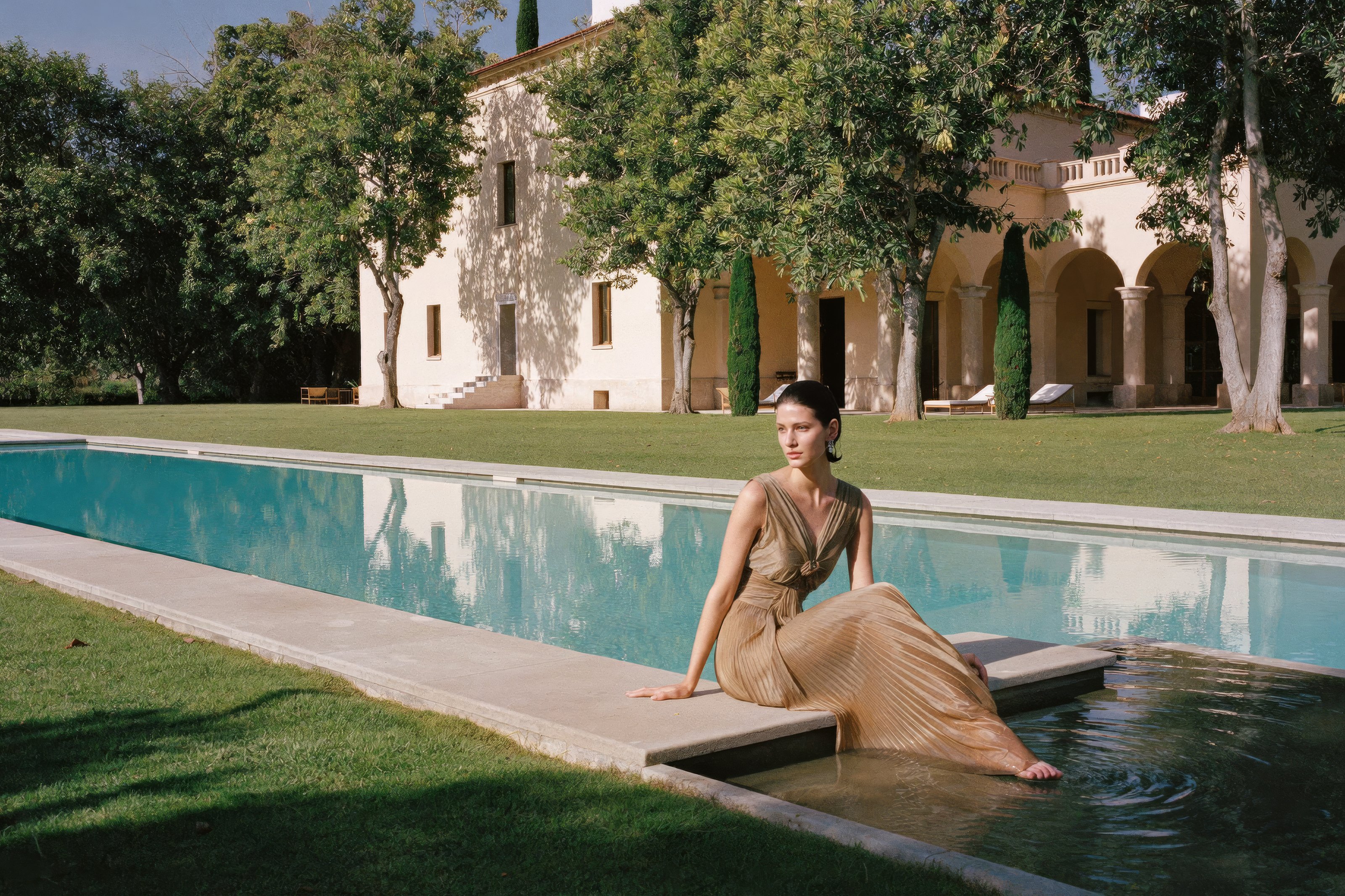 Villa Necchi: Villa Necchi Campiglio, by the pool. Pleated camel silk gown.