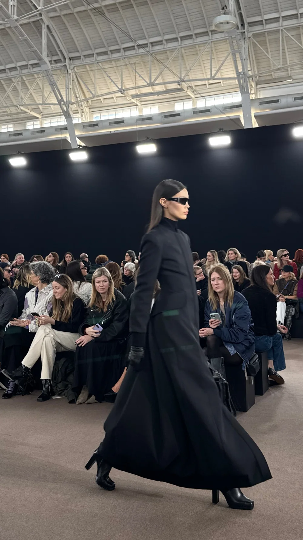 The black coat walks