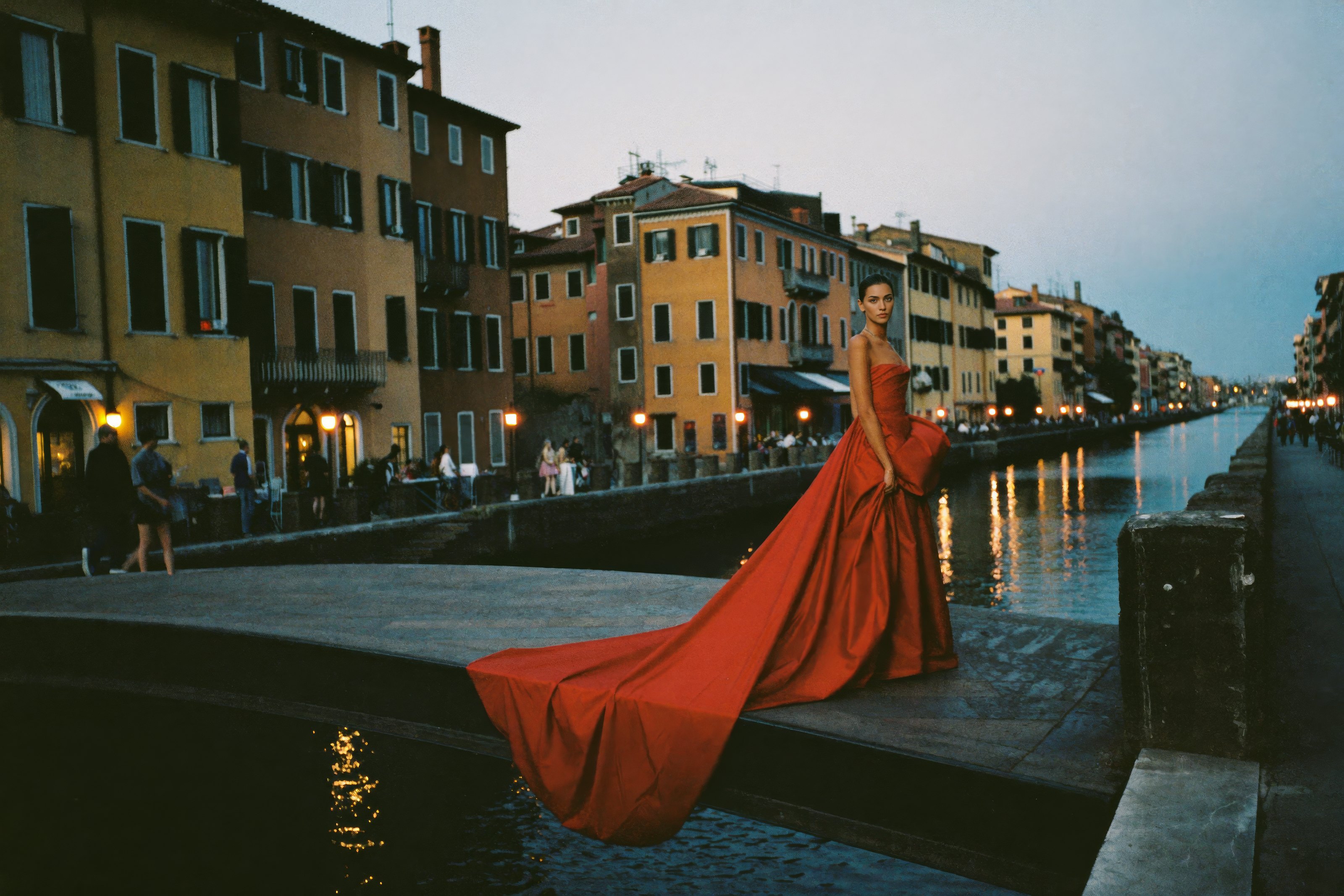 Il Naviglio: Naviglio Grande, the iron footbridge. Red satin gown, the train in the wind.